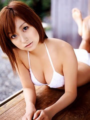 Short haired asian chick taunts in her little wet pink bikini
